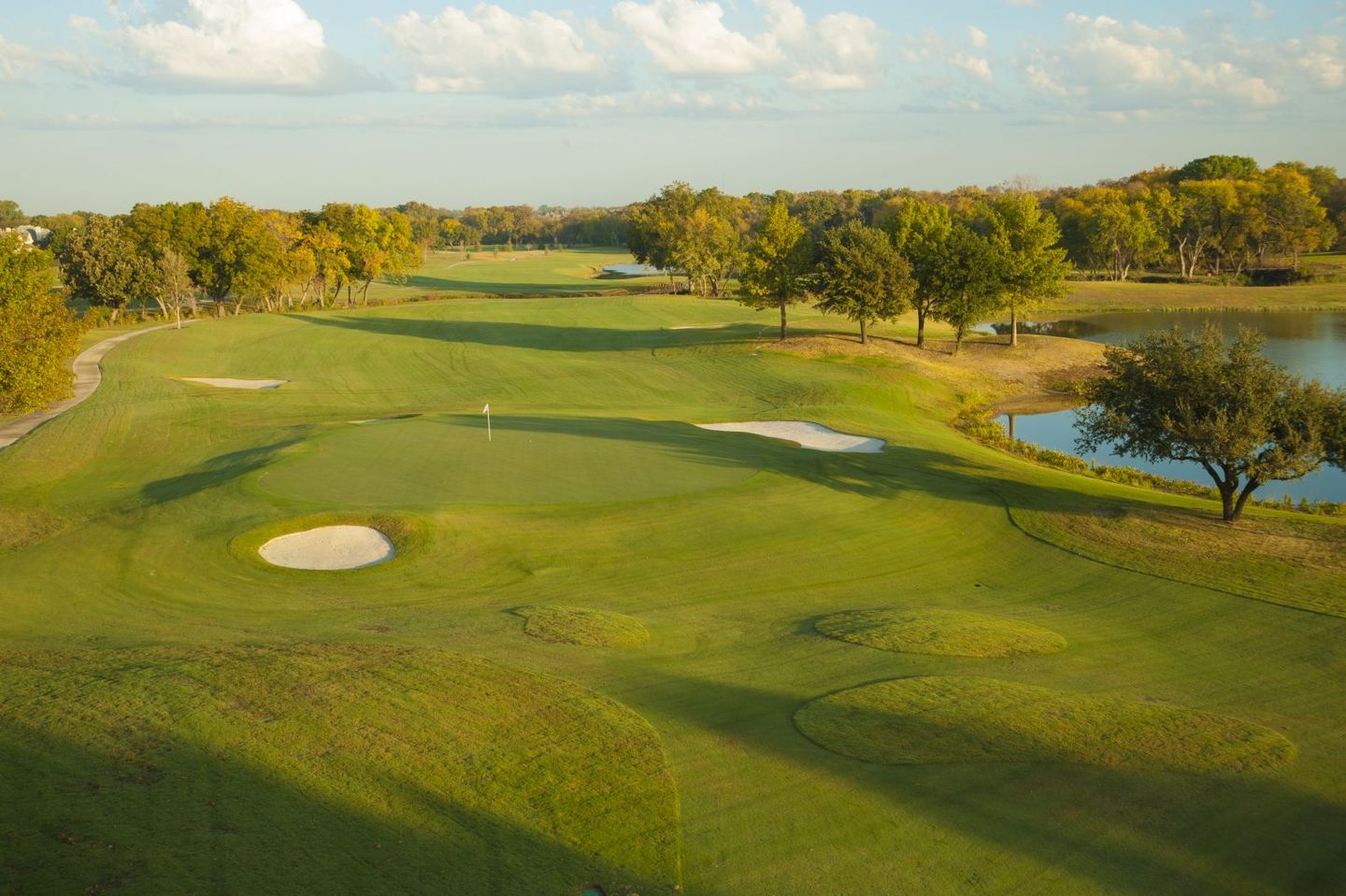 Hole 18 - fairway view with trees and bunkers